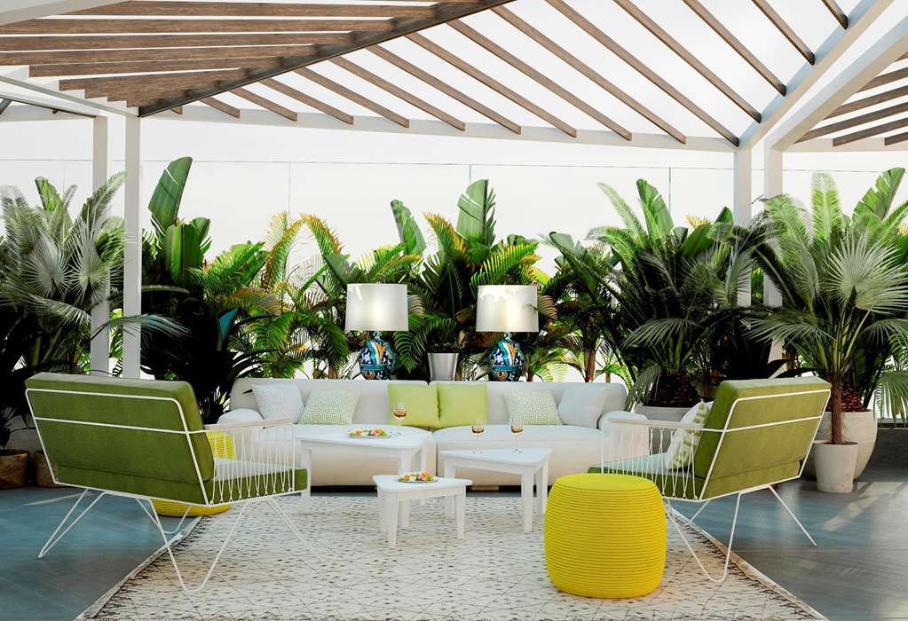 فندق هيلتون تانجر سيتي سنتر آند ريزدنسز طنجة المطعم الصورة The interior of the hotel